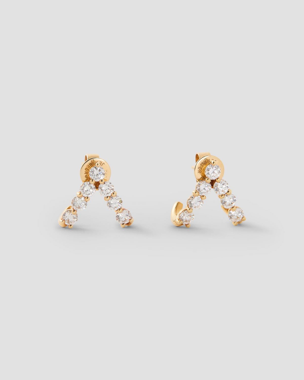 Floating Seven Diamond Double Huggies 18K gold earring - front view | diamond huggie earrings